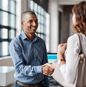 A man shaking hands with a women