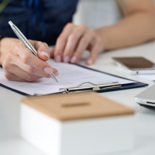A women filling out paperwork